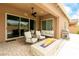 Cozy outdoor patio with comfortable seating around a fire pit, perfect for relaxing or entertaining at 5616 Silver Cascade Ave, Las Vegas, NV 89131