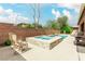 Inviting pool and spa combo with stone accents and ample seating space for outdoor enjoyment at 5616 Silver Cascade Ave, Las Vegas, NV 89131