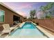 Backyard oasis featuring a sparkling pool, a spa, and ample seating for relaxation at 5616 Silver Cascade Ave, Las Vegas, NV 89131