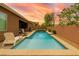 Beautiful backyard with a private pool, jacuzzi and lounge area for relaxing and entertaining guests at 5616 Silver Cascade Ave, Las Vegas, NV 89131