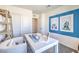 Bright home office with white desk, modern chair, and stylish decor at 6188 Hibiscus Garden St # 174, North Las Vegas, NV 89081