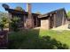 Charming brick home with a cozy front yard and a brick chimney under a bright blue sky at 6521 Sugarpine Ln, Las Vegas, NV 89107
