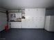 This garage contains white cabinets and counter space for plenty of storage and work area at 6521 Sugarpine Ln, Las Vegas, NV 89107