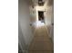 Hallway with tile flooring connecting to rooms and providing access to different parts of the house at 6521 Sugarpine Ln, Las Vegas, NV 89107
