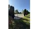 Community tennis court surrounded by trees, perfect for recreational activities at 6521 Sugarpine Ln, Las Vegas, NV 89107