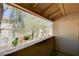 This balcony has a door, offering a view of the property and landscaping at 7200 Pirates Cove Rd # 2084, Las Vegas, NV 89145