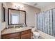 Bathroom with granite countertops, large mirror, and shower-tub combo at 7200 Pirates Cove Rd # 2084, Las Vegas, NV 89145