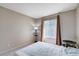 Bedroom with a comfortable bed, a table lamp, and a window with vertical blinds at 7200 Pirates Cove Rd # 2084, Las Vegas, NV 89145