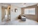 Cozy bedroom featuring a ceiling fan and a comfortable armchair with an ottoman at 7200 Pirates Cove Rd # 2084, Las Vegas, NV 89145
