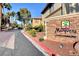 Marquesa Condominiums features lush landscaping and eye-catching stone signage at 7200 Pirates Cove Rd # 2084, Las Vegas, NV 89145