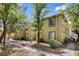 Beautifully landscaped exterior with shade trees, sidewalks, and a well maintained lawn at 7200 Pirates Cove Rd # 2084, Las Vegas, NV 89145