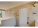 Entryway with a white door, number 2084, and textured walls at 7200 Pirates Cove Rd # 2084, Las Vegas, NV 89145