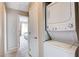 Hallway with laundry closet including a stackable washer and dryer at 7200 Pirates Cove Rd # 2084, Las Vegas, NV 89145