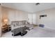 Comfortable living room with a sectional sofa, perfect for relaxing or entertaining guests at 7200 Pirates Cove Rd # 2084, Las Vegas, NV 89145