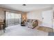 Living room featuring a sliding glass door offering natural light and access to a balcony at 7200 Pirates Cove Rd # 2084, Las Vegas, NV 89145