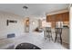 Inviting living room and kitchen area with barstool seating and a neutral color palette at 7200 Pirates Cove Rd # 2084, Las Vegas, NV 89145