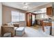 Living space with a chair, ottoman, stainless steel appliances and kitchen view at 7200 Pirates Cove Rd # 2084, Las Vegas, NV 89145