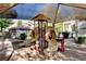 Community playground with slides and canopy shade structure at 7200 Pirates Cove Rd # 2084, Las Vegas, NV 89145