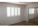 Bright bedroom with custom window shutters and mirrored closet doors at 730 Goshawk St, Henderson, NV 89015