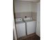 Efficient laundry area featuring a washer and dryer, maximizing space and convenience at 730 Goshawk St, Henderson, NV 89015