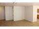 A spacious, well lit living room featuring tile flooring and base molding at 730 Goshawk St, Henderson, NV 89015