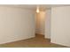 A well lit living room area featuring tile flooring and base molding at 730 Goshawk St, Henderson, NV 89015
