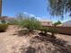 Backyard featuring desert landscaping, gravel and trees at 732 Goshawk St, Henderson, NV 89015