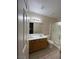 Bright bathroom featuring a double sink vanity, large mirror, and glass-enclosed shower at 732 Goshawk St, Henderson, NV 89015