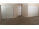 This carpeted bedroom offers spacious closets, a neutral paint color and white trim at 732 Goshawk St, Henderson, NV 89015