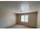 Bright bedroom featuring plush carpeting, a large window, and a serene ambiance at 732 Goshawk St, Henderson, NV 89015
