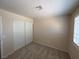 Bedroom featuring neutral walls, plush carpet, and closet with sliding doors at 732 Goshawk St, Henderson, NV 89015