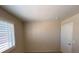 This bedroom features neutral walls, window with white shutters and a white door at 732 Goshawk St, Henderson, NV 89015