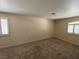 Spacious bedroom showcasing carpeted floors, neutral walls and shuttered windows at 732 Goshawk St, Henderson, NV 89015