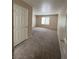 A spacious bedroom with neutral carpeting and ample natural light from the window at 732 Goshawk St, Henderson, NV 89015