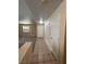 Bright entryway with tile flooring, neutral walls, and a view into the living room featuring plantation shutters at 732 Goshawk St, Henderson, NV 89015