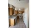 Kitchen featuring tile floor, light wood cabinets, and white appliances at 732 Goshawk St, Henderson, NV 89015