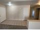 Inviting living room featuring tile flooring, neutral walls, and a view of the hallway and a second entry door at 732 Goshawk St, Henderson, NV 89015