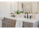 Modern bathroom features a double sink vanity with gray cabinetry, white countertop, and stylish decor at 8140 Bay Harbor Dr, Las Vegas, NV 89128