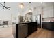Open-concept kitchen featuring an island with stainless steel dishwasher and modern pendant lighting at 8140 Bay Harbor Dr, Las Vegas, NV 89128