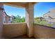 Balcony offering a serene view of lush greenery and clear blue skies, perfect for relaxation at 8501 W University Ave # 2020, Las Vegas, NV 89147