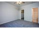 Carpeted bedroom features a closet and a bathroom doorway at 8501 W University Ave # 2020, Las Vegas, NV 89147