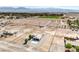 Stunning aerial view showcasing a well-maintained single Gathering home and large lot in a desert setting at 861 S Ford Loop, Pahrump, NV 89048
