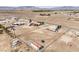 Expansive aerial view of a desert property with a fenced lot and mountain views at 861 S Ford Loop, Pahrump, NV 89048