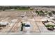 Aerial view showing a single-story home with a two-car garage surrounded by a large lot at 861 S Ford Loop, Pahrump, NV 89048