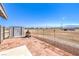 Expansive backyard with a brick patio, fire pit, and outbuildings at 861 S Ford Loop, Pahrump, NV 89048