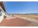 Spacious backyard featuring furniture, brick patio, and mountain views at 861 S Ford Loop, Pahrump, NV 89048