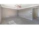 Spacious bedroom with neutral walls, ceiling fan, and plush carpeting at 861 S Ford Loop, Pahrump, NV 89048