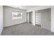 Spacious bedroom with carpet, window and dual sliding door closet at 861 S Ford Loop, Pahrump, NV 89048