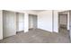 Bright bedroom featuring carpeted floor, closet and open door at 861 S Ford Loop, Pahrump, NV 89048