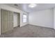 Cozy bedroom with carpet flooring, closet, and a window for natural light at 861 S Ford Loop, Pahrump, NV 89048